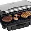 Bestron Elektrischer Kontaktgrill Mit Auffangschale, Sandwichmaker Mit Cool-Touch-Handgriff & Antihaftbeschichtung, Paninimaker Mit 1000 Watt, ASW113S, Farbe: Silber / Schwarz 1 Bestron Elektrischer Kontaktgrill Mit Auffangschale, Sandwichmaker Mit Cool-Touch-Handgriff & Antihaftbeschichtung, Paninimaker Mit 1000 Watt, ASW113S, Farbe: Silber / Schwarz -Tepro Verkäufe 2024 7fcdc4471fa42a45918eeb7469342af9